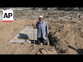 As Gaza death toll passes 40,000, corpses are buried in yards, streets, tiered graves