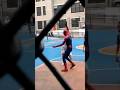 Spider-Man playing basketball with the kids