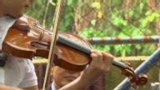 Japanese musician teaches Rio favela youngsters