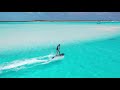 radinn x the bahamas caribbean blue cruising on a motorized surfboard