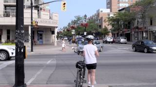 B-roll of pedestrians crossing streets, busy intersections and vehicle traffic