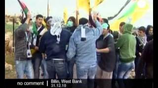 Protesters march against separation barrier...