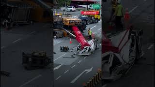 According to The Straits Times, the driver jumped out of the van before it was crushed by the crane.