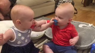 Twin Babies Fight Over Pacifiers