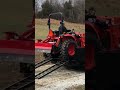 Hillbilly Redneck loading Tractor in a Dump Trailer.