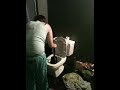 jenni plunging a toilet