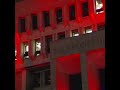 Landmarks lit in red on eve of firefighter's funeral