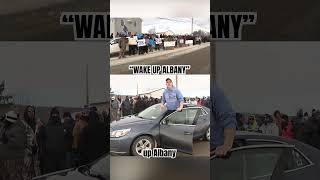 A supporter joins corrections officers in New York as they strike outside a WNY prison.