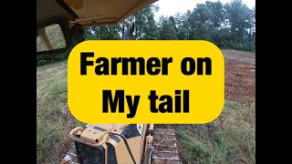 Using Cat dozer to repair dry dams in a field