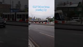 CAF Urbos tram passing by