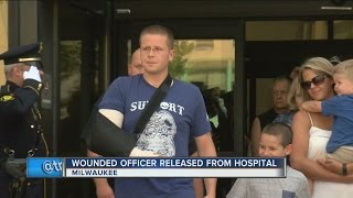 Wounded Milwaukee police officer leaves hospital, is saluted