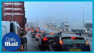 Extreme weather: Cars stranded on motorway as M62 brought to standstill from heavy snow