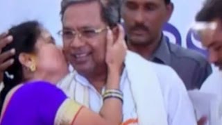 SHOCKING: Woman Kisses Karnataka CM Siddaramaiah in Public