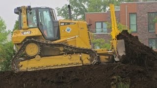 CATERPILLAR DOZER D6N PUSHING TOPSOIL + GRADING SURFACE