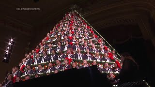 Dozens of Michigan high school choir students perform in 67-foot Singing Christmas Tree