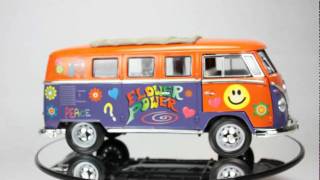 VW Microbus with surfboard flower power Orange