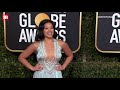 Gina Rodriguez and Joe LoCicero share a kiss at Golden Globes