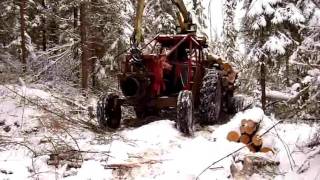 MF-65 passing by with a load of firewood.