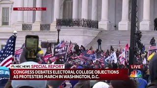 Protestors begin to breach barricades at the Capitol