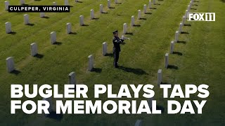 Bugler from U.S. Air Force Band performs 'Taps' at veterans cemetery in honor of Memorial Day