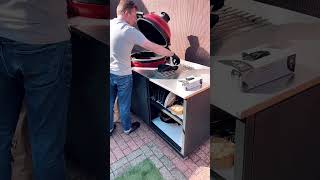 Filling up fire basket with charcoals. BIG4SPACE outdoor kamado kitchens from KamadoSpace UK.