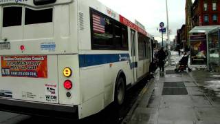 MaBSTOA Downtown Bound Orion 7 HEV M7 #6410 and New Flyer D60HF #5537 M102 at 125th Street/6th Ave.