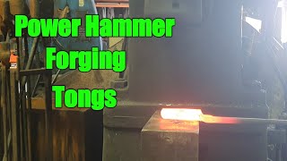 Blacksmith forging some tongs. massey power hammer forging