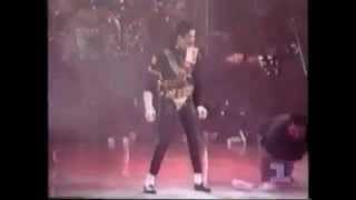 Michael Jackson sliding and dancing on a wet stage.