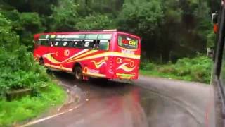 Red Bus avoids collision with KSRTC bus in rain soaked Charmadi