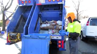 Edison demonstrates how he empties paper recycling carts