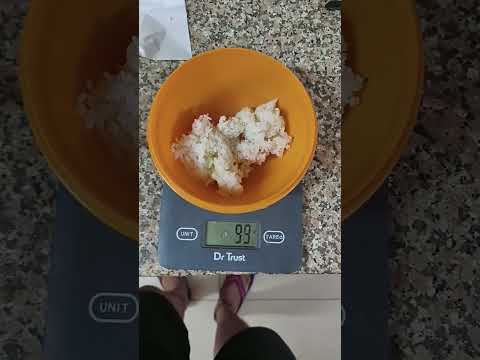 How much is 100g rice when cooked?
