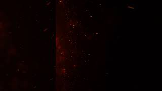 4k fire embers fire Particles sparks over black background, Fire flames particles swirls in the air.