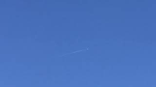 Socata TBM 940 cruising overhead with contrails at 30,000 ft