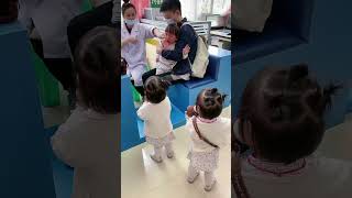 I took my triplets to line up for vaccinations, and they cried the same way.