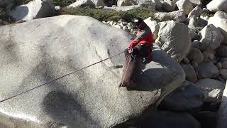 Guide crossing river using Tyrolean traverse