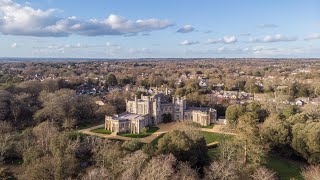 Aerial cinematic footage of the Highcliffe Castle, Dorset, UK on a beautiful sunny day.