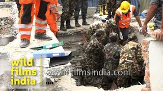 Rescue team takes out dead bodies from debris - Nepal earthquake