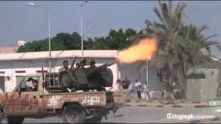 Libya conflict: rebels fight their way into Col Gaddafi's compound