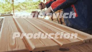 The working joiner processes boards. Wire brush during machining wood. Brushing wood work