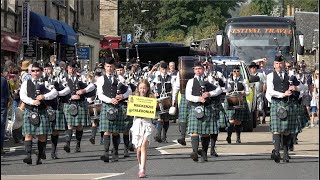 Mackenzie Caledonian Pipe Band in street parade marching to 2023 Pitlochry Highland Games