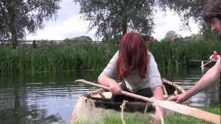 Coracles. Racing on the River Stour at Bures. Documentary