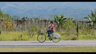 woman ride a bike in countryside TCQZ933