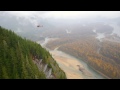 behind the scenes hanging from a rock face for avalanche safety