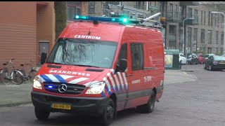 Duikwagen brandweer Den Haag Centrum met spoed onderweg naar een Persoon te water in Den Haag