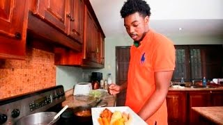 IN THE KITCHEN: Devin Di Dakta serves stewed chicken