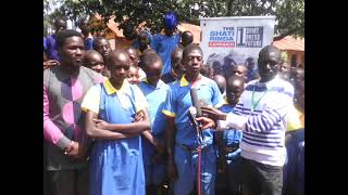 STUDENTS OF  NYANGE  DEB  PRIMARY SCHOOL AFTER RECEIVING SCHOOL UNIFORMS FROM THIRSTY SHONA TEXTILES