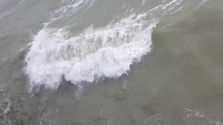 Brighton pier in summer July 30th in storm 12ft waves 60mph winds