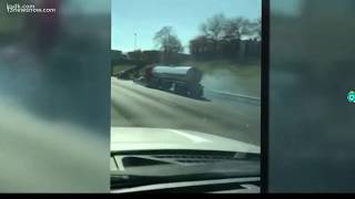 Car gets stuck in grill of semi-trailer truck