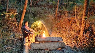 Solo camping in the wilderness, building survival shelter with tarp, Bushcraft camp