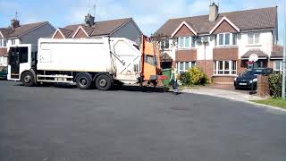 Oxigen bin lorry collecting green bins (recycling bins)